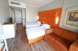 Postel nebo postele na pokoji v ubytování Beau Site Hotel