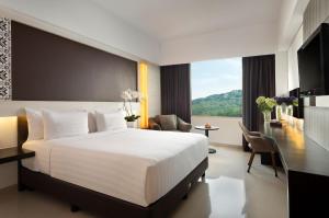 Tempat tidur dalam kamar di Atria Hotel Magelang