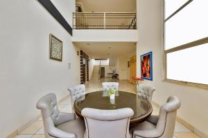 a dining room with a table and chairs at Cinere Inn & Residence in Cinere