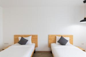 Ananzitra Hotel客房内的一张或多张床位