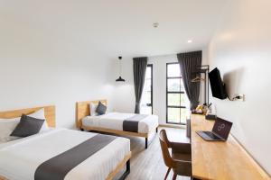 Ananzitra Hotel客房内的一张或多张床位
