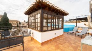 a roof top deck with a gazebo at Carmen San Luis Albaicin, Granada in Granada