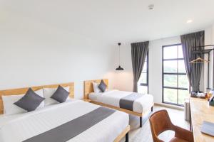 Ananzitra Hotel客房内的一张或多张床位