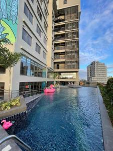 a swimming pool in the middle of a building at lyf Cebu City - Managed by The Ascott Limited in Cebu City