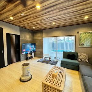 TV a/nebo společenská místnost v ubytování The No.10 Sunrise Beach 九十九里 + 21 fotografií