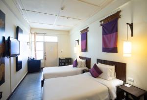 Postel nebo postele na pokoji v ubytování Eco Resort Chiang Mai