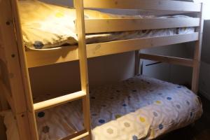 Letto o letti a castello in una camera di AL 48 - Duplex Bagatel