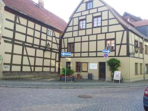 a couple of half timbered buildings on a street at Ferienwohnung im Denkmal in Havelberg