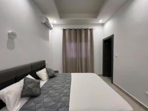 a bedroom with a large bed in a room at Lovers Villa Somone in Somone +8 photos