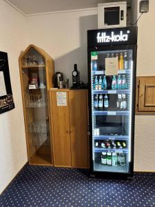 a refrigerator filled with lots of drinks in a room at Neugebauer-Garni, Johannisberg in Johannisberg