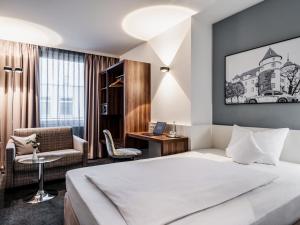 מיטה או מיטות בחדר ב-Hotel Royal