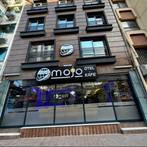 a moo shop on the side of a building at mojo otel in Konak