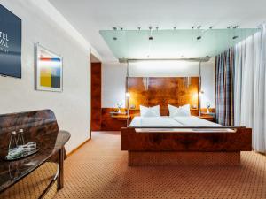מיטה או מיטות בחדר ב-Hotel Royal