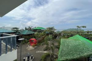 a view from the balcony of a resort at Lover's Point Beach Front Resort in Lian