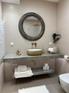 a bathroom with a sink and a mirror on the wall at Panorama Apartments Vienna in Vienna