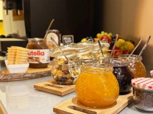 a counter with jars of honey and other food at Grimm's Berlin Mitte in Berlin