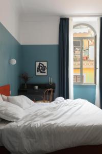 A bed or beds in a room at Passepartout Még 37 kép