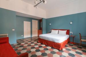 A bed or beds in a room at Passepartout