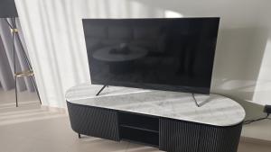 a flat screen tv sitting on top of a table at MH - Act One Act Two - 2BHK- REF3002 in Dubai
