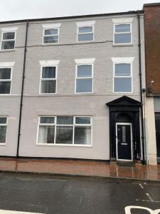 a building with a door on the side of a street at Maritime House Two in Hull