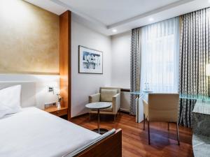 מיטה או מיטות בחדר ב-Hotel Royal