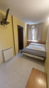Postel nebo postele na pokoji v ubytování Hostal Rural Sositana