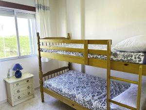 Postel nebo postele na pokoji v ubytování LIFE APARTMENTS EL PORTIL + 14 fotografií