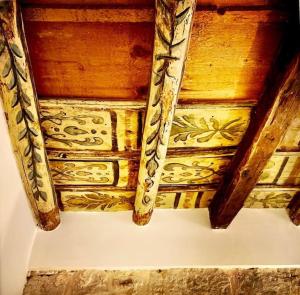 a wooden ceiling with intricate designs on it at Casa Verderame in Palermo