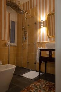 a bathroom with a shower and a toilet and a sink at Casa Verderame in Palermo