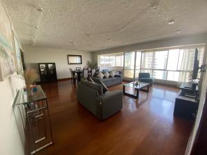 a living room with a couch and a table at Oceanfront Miraflores Larcomar next to Marriott in Lima