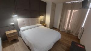 Postel nebo postele na pokoji v ubytování Hostal Rural Sositana