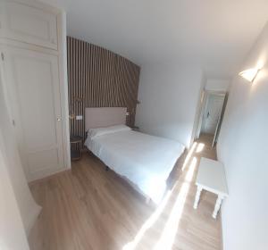 Postel nebo postele na pokoji v ubytování Hostal Rural Sositana