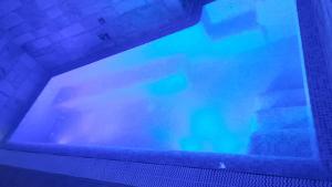 a view of a tv screen in a swimming pool at Trulli e Puglia Luxury Suite in Alberobello