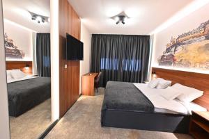 Katil atau katil-katil dalam bilik di Tvrdjava Rooms - Novi Sad