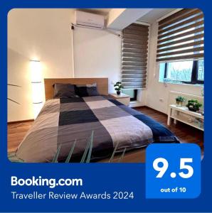 a bedroom with a bed and a window with blinds at Cozy Apartment with Self Check-in near Promenada Mall and Verdi Park in Bucharest