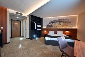 Katil atau katil-katil dalam bilik di Tvrdjava Rooms - Novi Sad