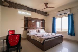 Ένα ή περισσότερα κρεβάτια σε δωμάτιο στο Hotel Nilkantha