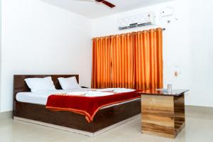 Ένα ή περισσότερα κρεβάτια σε δωμάτιο στο Hotel Nilkantha