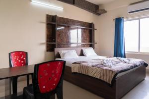 Ένα ή περισσότερα κρεβάτια σε δωμάτιο στο Hotel Nilkantha