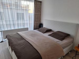 Ліжко або ліжка в номері Residentie Isis