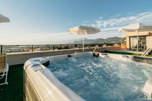 a hot tub on the roof of a house at Apartments Monsurei, Lake view in Bardolino
