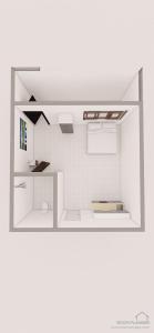 Rooftop Studio Apartment - Mirema في نيروبي: غرفة صغيرة مع جدار من البلاط الأبيض