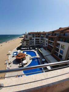a view of a hotel with a beach and the ocean at Apartment with Sea View in Obzor Beach in Obzor