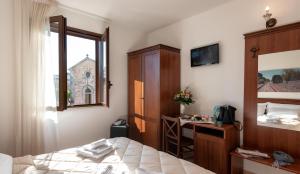 A bed or beds in a room at Relais Casina Copini