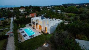 an aerial view of a house with a swimming pool at Filerimos Oasis Villa in Ialysos