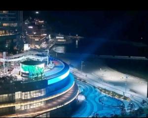 a view of a building at night with blue lights at Happy House in Busan