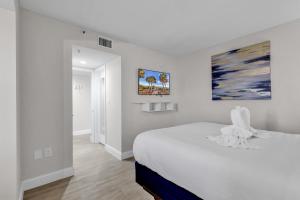 Voodi või voodid majutusasutuse 2BR Condo with Ocean View toas