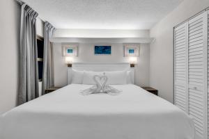 Voodi või voodid majutusasutuse 2BR Condo with Ocean View toas