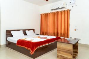 Ένα ή περισσότερα κρεβάτια σε δωμάτιο στο Hotel Nilkantha
