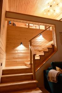 a wooden staircase in a tiny house at Zillya Club in Tatariv